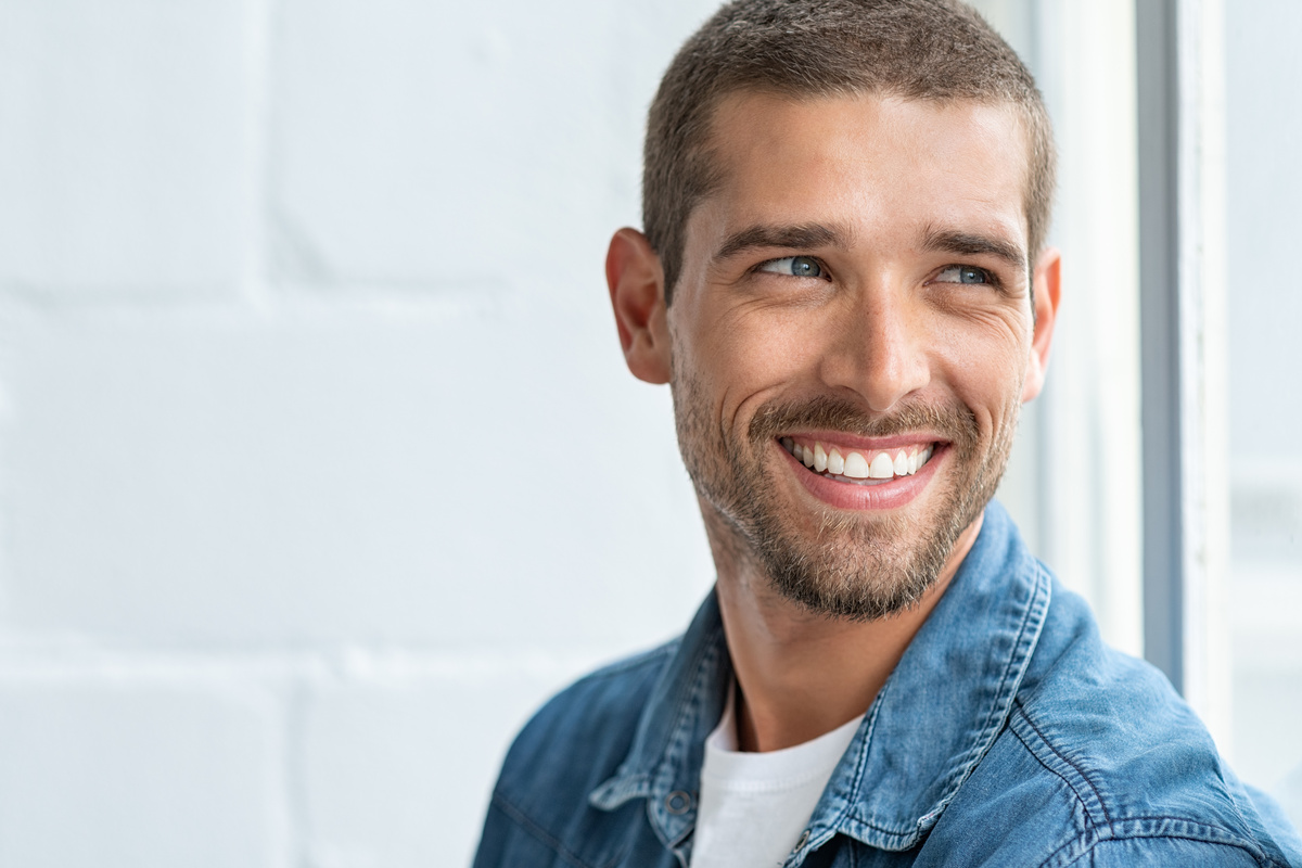 Happy smiling man looking away