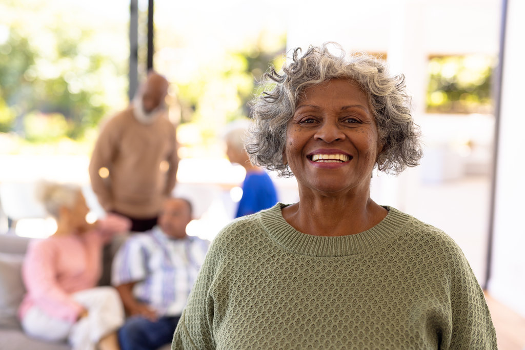 Portrait of smiling african american senior woman standing with